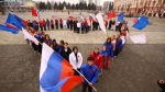Молодогвардейцы приняли участие во флешмобе «Флаг единства» в годовщину воссоединения Крыма с Россией